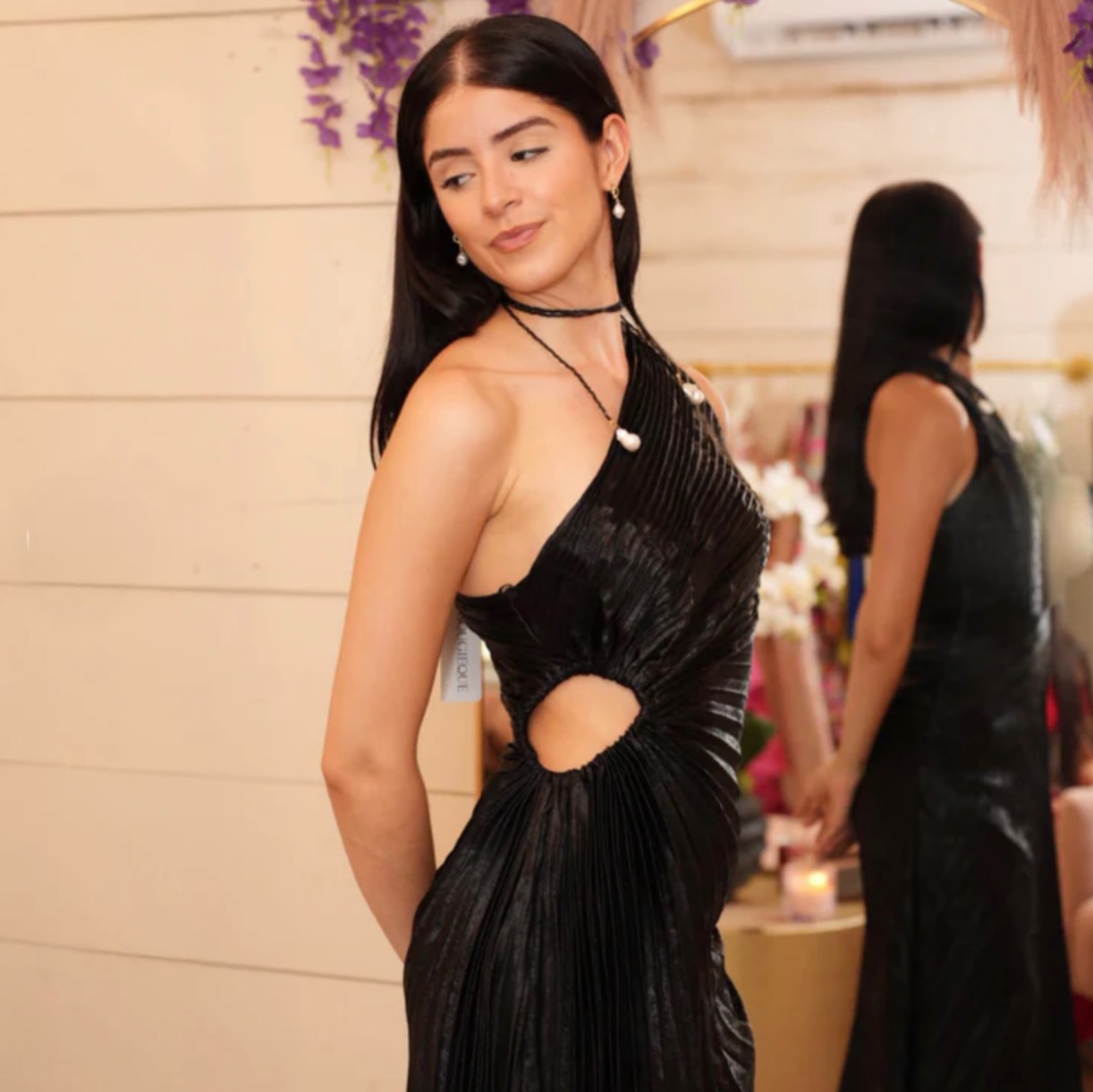 Elevate your evening look with a black statement dress designed to flatter every angle. Perfect for 