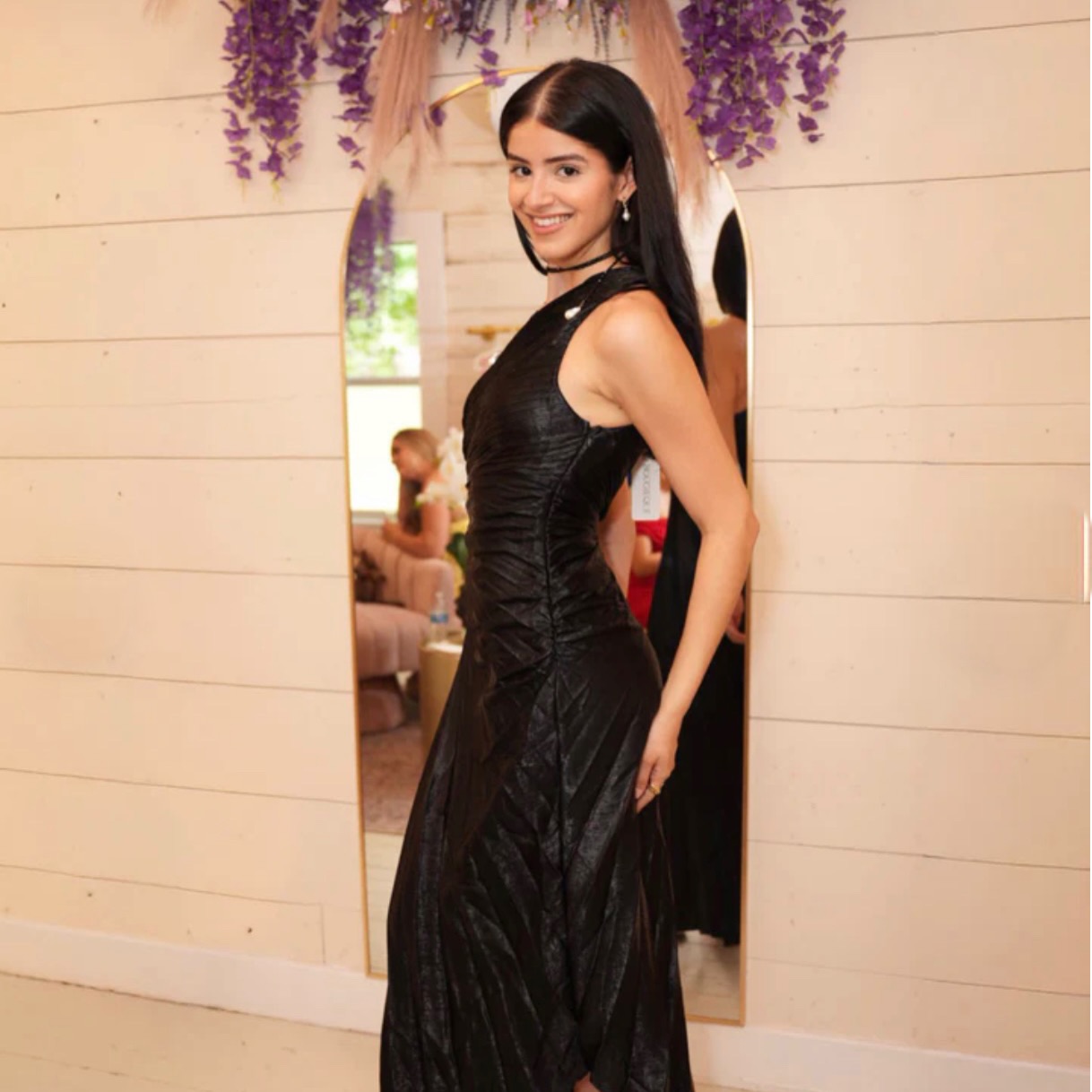 Elevate your evening look with a black statement dress designed to flatter every angle. Perfect for 