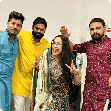 Team dressed in festive wear for a celebration